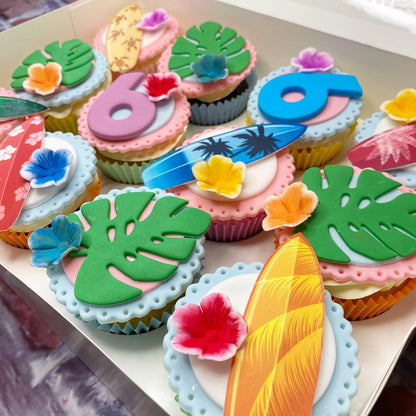 Decorative cupcakes with tropical-themed frosting 