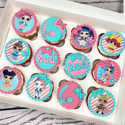 Cupcakes with decorative toppers featuring LOL Surprise characters and the name 'Rua'.