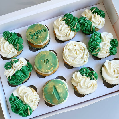 Decorative cupcakes with green and white icing
