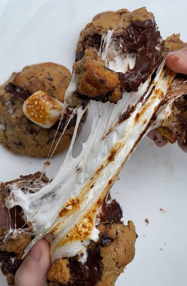 Bakery-style S’more cookies loaded with gooey melted marshmallow, dark chocolate and milk chocolate.