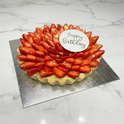 Strawberry tart with a 'Happy Birthday' 